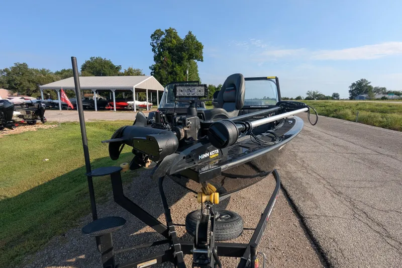 Slide: The Image of 2023 Tracker Targa V-19 Combo Tournament Edition boat on trailer, outdoor setting. - 13