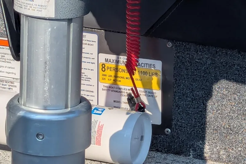 Slide: The Image of 2023 Tracker Targa V-19 Combo boat capacity label, showing 8-person limit and safety details. - 17