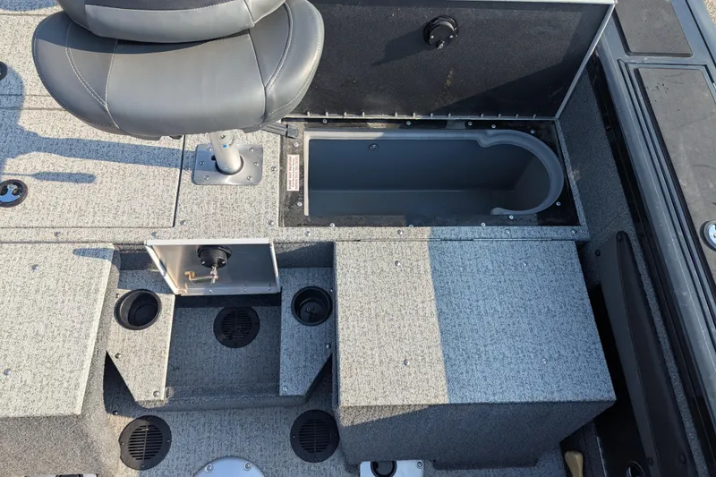 Slide: The Image of 2023 Tracker Targa V-19 Combo Tournament Edition boat interior with seating and storage compartments. - 22