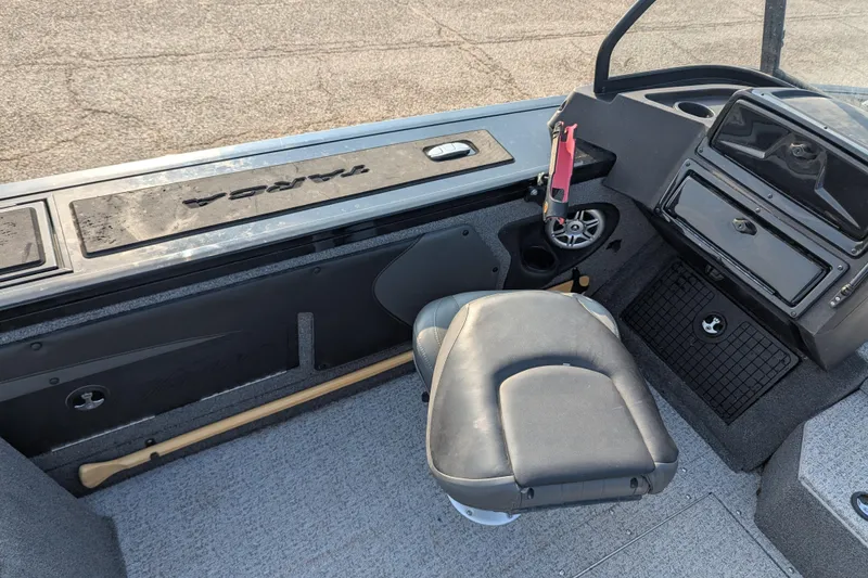 Slide: The Image of 2023 Tracker Targa V-19 Combo Tournament Edition boat interior with seating and console. - 25