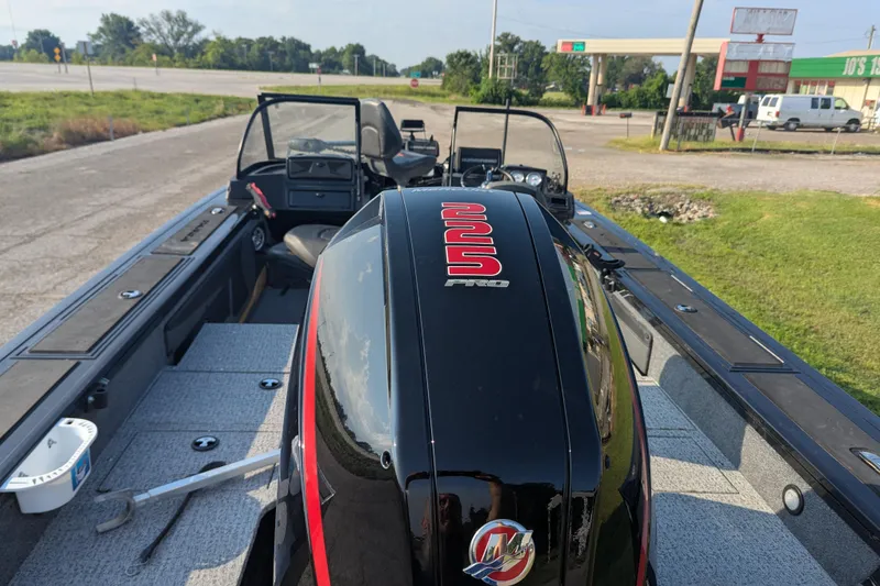 Slide: The Image of 2023 Tracker Targa V-19 Combo Tournament Edition boat with powerful engine, parked outdoors. - 6