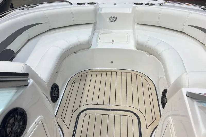 Slide: The Image of 2022 Hurricane SunDeck 187 IO boat interior with white seating and wood-style flooring. - 10