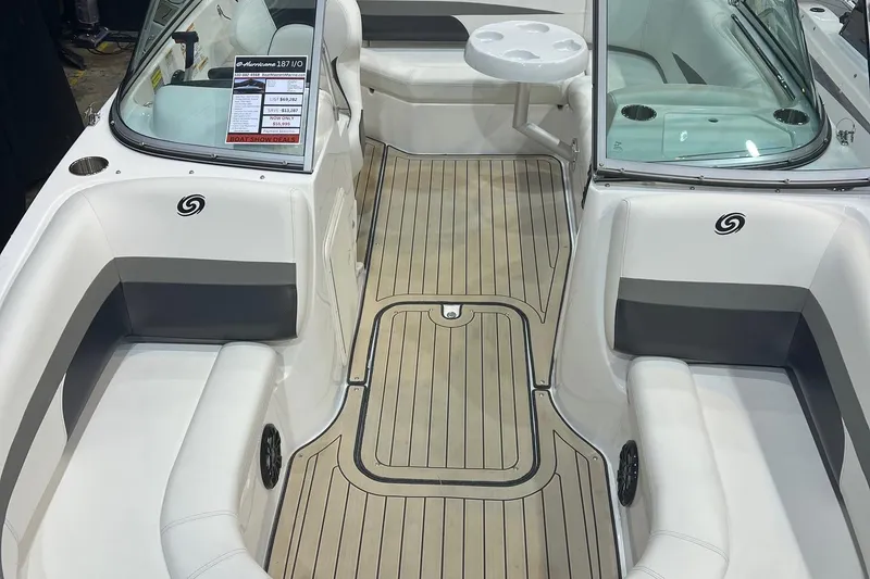 Slide: The Image of 2022 Hurricane SunDeck 187 IO boat interior with seating and table. - 11
