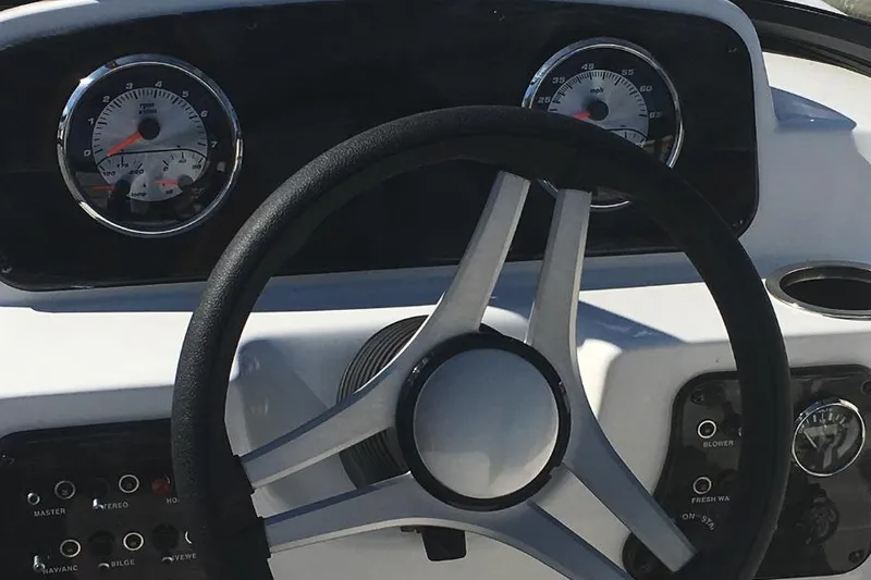 Slide: The Image of Manufacturer Provided Image: 2023 Hurricane SunDeck 187 IO boat dashboard with steering wheel and gauges. - 12