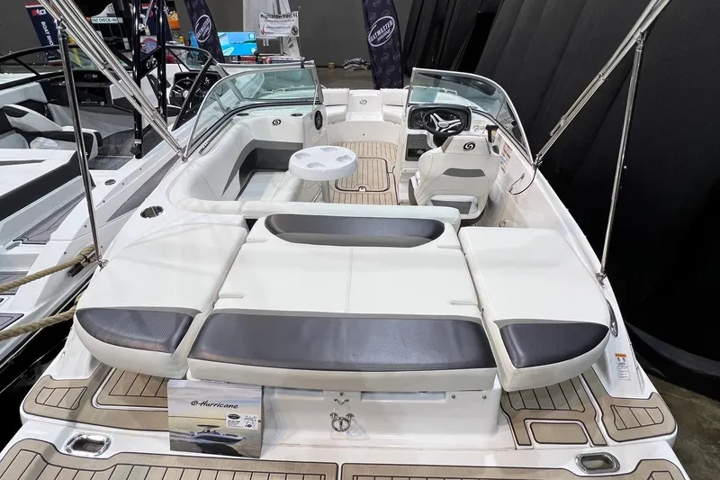 Slide: The Image of 2022 Hurricane SunDeck 187 IO boat interior with seating and steering wheel. - 5