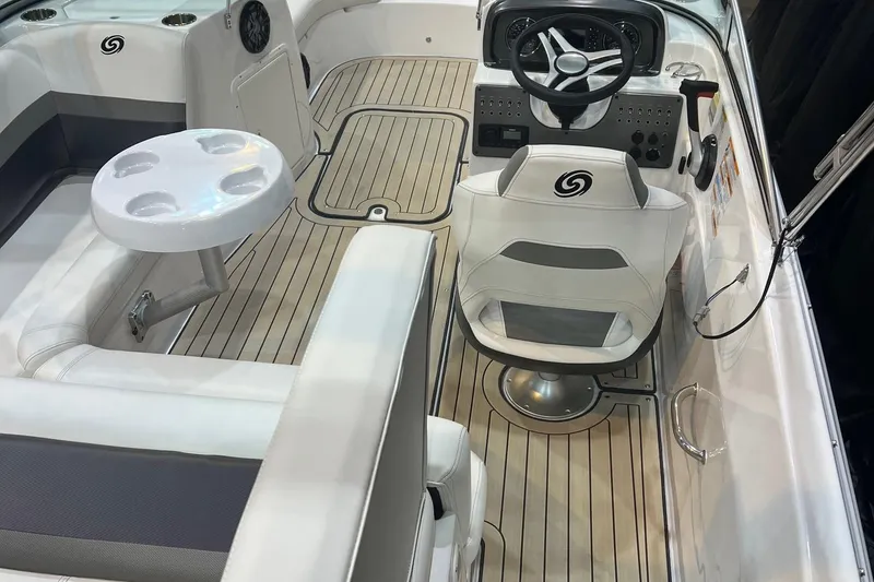 Slide: The Image of Interior of 2022 Hurricane SunDeck 187 IO boat with steering wheel and seating. - 7