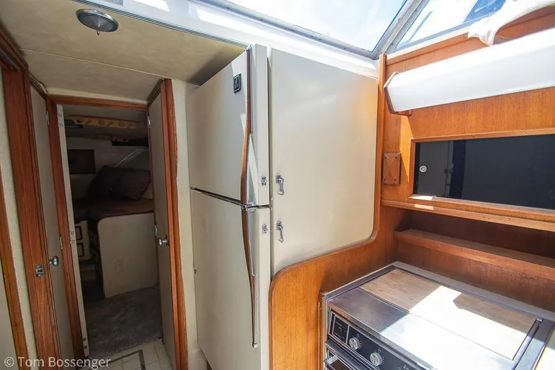 Slide: The Image of Interior of 1986 Bertram 42 Convertible yacht with kitchen and cabin view. - 17