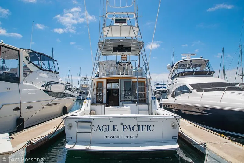 Slide: The Image of 1986 Bertram 42 Convertible yacht docked at Newport Beach marina. - 2