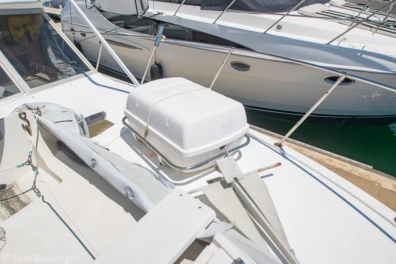 Slide: The Image of 1986 Bertram 42 Convertible yacht deck with anchor and storage box. - 39