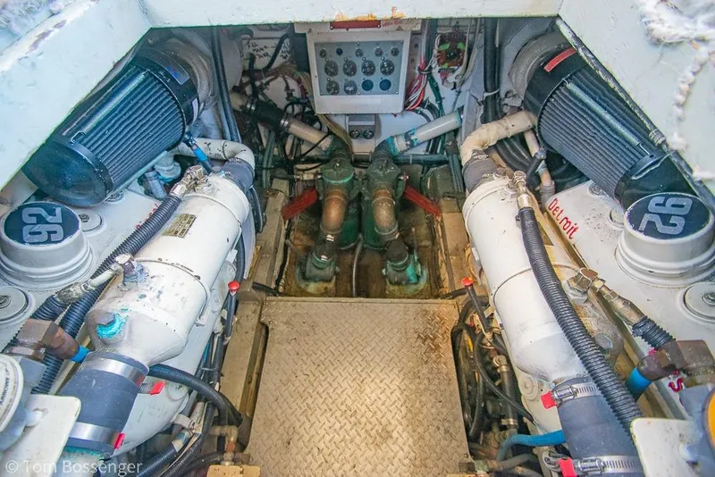 Slide: The Image of Engine room of a 1986 Bertram 42 Convertible boat, showcasing mechanical components. - 40