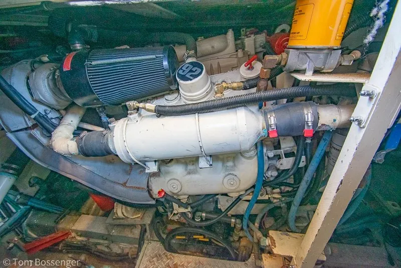 Slide: The Image of Engine compartment of a 1986 Bertram 42 Convertible boat, showcasing mechanical components. - 41