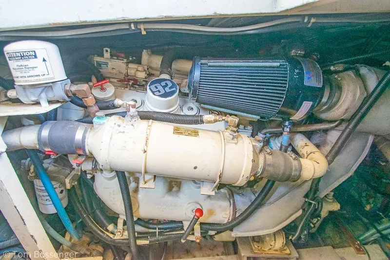 Slide: The Image of Engine compartment of a 1986 Bertram 42 Convertible boat, showcasing mechanical components. - 42