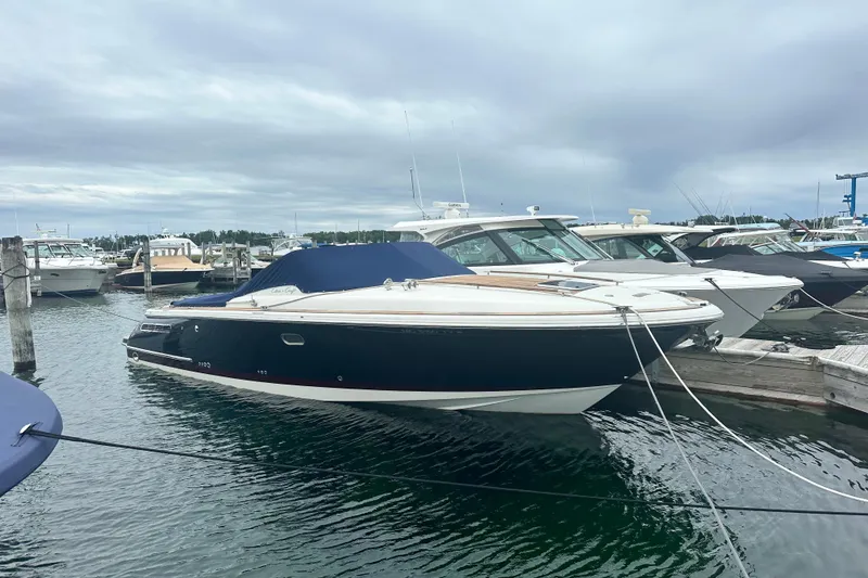 The Image of 2007 Chris-Craft Corsair 33 Heritage Edition docked at marina, overcast sky. - 0