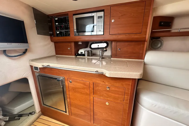 Slide: The Image of Luxurious 2007 Chris-Craft Corsair 33 Heritage Edition cabin with kitchenette and modern amenities. - 17