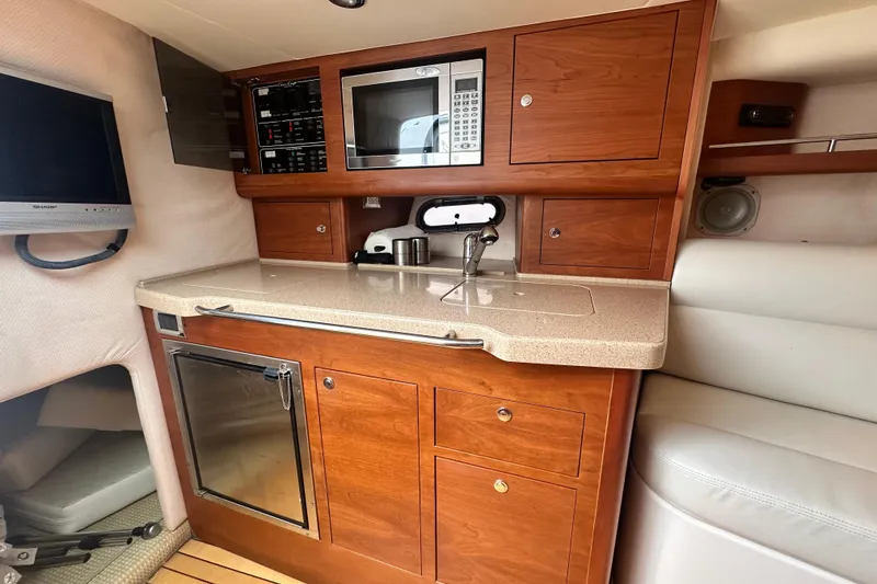 Slide: The Image of Luxurious 2007 Chris-Craft Corsair 33 Heritage Edition cabin with kitchenette and modern amenities. - 18