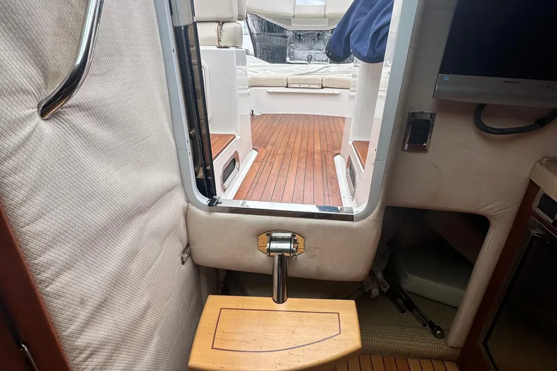 Slide: The Image of Interior view of 2007 Chris-Craft Corsair 33 Heritage Edition, featuring wooden flooring and seating area. - 21