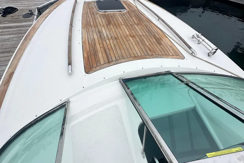 Slide: The Image of 2007 Chris-Craft Corsair 33 Heritage Edition boat with teak deck and sleek windshield design. - 4