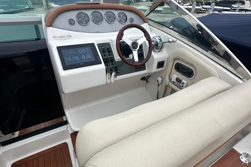 Slide: The Image of 2007 Chris-Craft Corsair 33 Heritage Edition helm with gauges and steering wheel. - 6