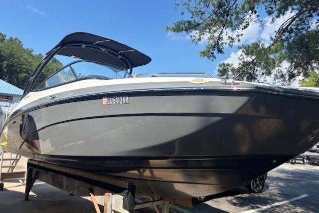 Slide: The Image of 2020 Yamaha AR240 boat on display, featuring sleek design and black canopy. - 14