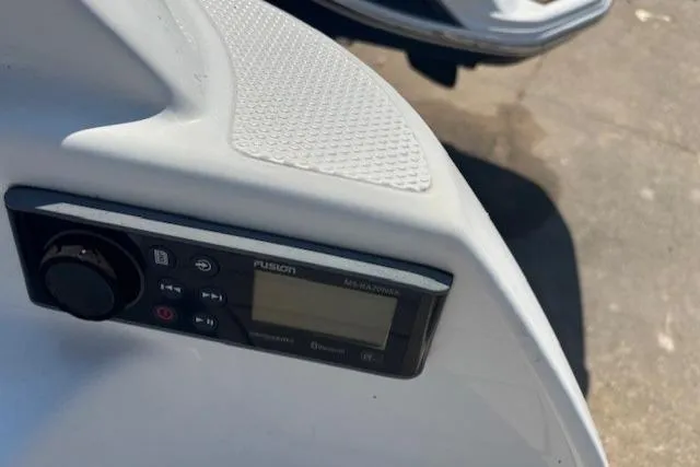 Slide: The Image of Control panel on a 2020 Yamaha AR240 boat, featuring a Fusion audio system. - 8