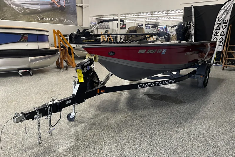 Slide: The Image of 2014 Crestliner 1750 Fish Hawk boat on trailer in showroom. - 1