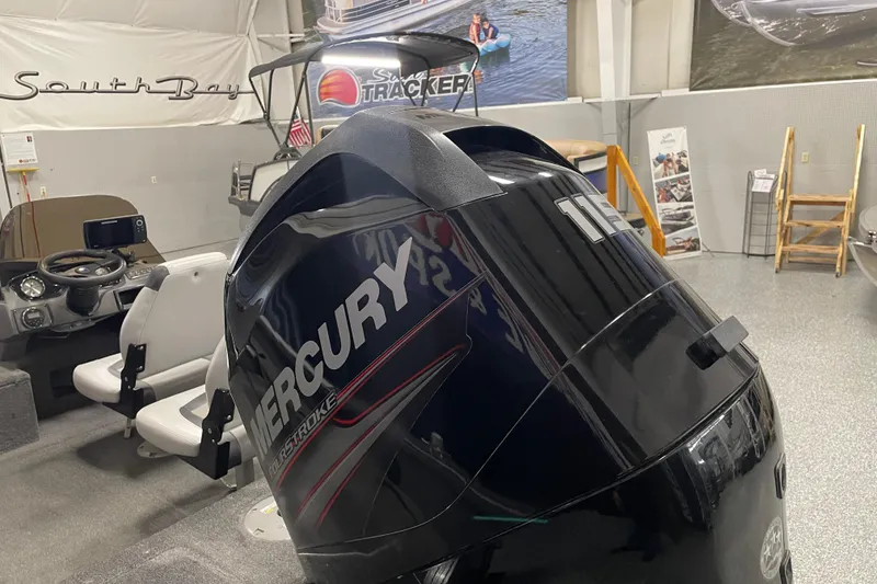 Slide: The Image of 2014 Crestliner 1750 Fish Hawk with Mercury outboard motor in showroom. - 10