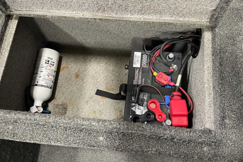 Slide: The Image of Battery compartment with fire extinguisher in 2014 Crestliner 1750 Fish Hawk boat. - 15