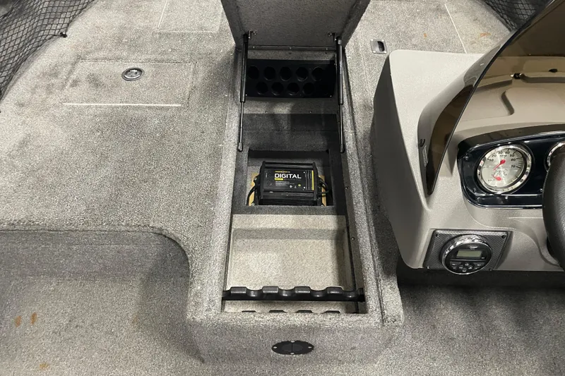 Slide: The Image of 2014 Crestliner 1750 Fish Hawk interior with digital display and storage compartments. - 17