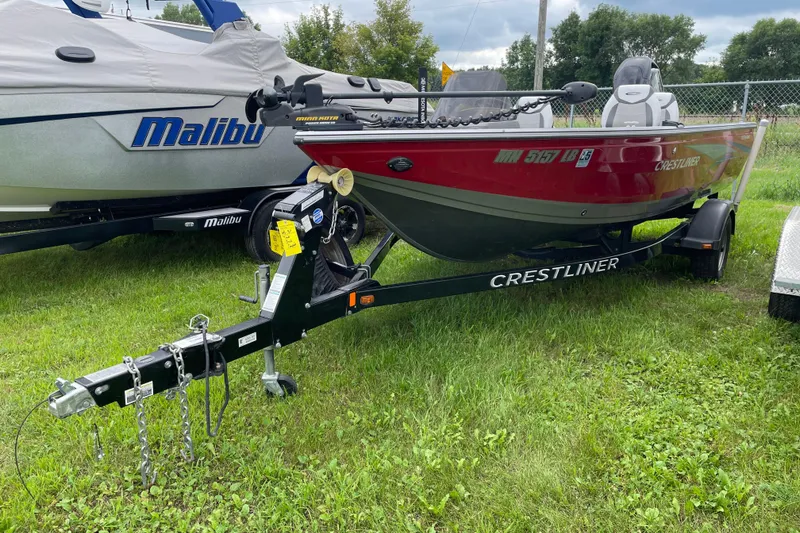 Slide: The Image of 2014 Crestliner 1750 Fish Hawk boat on trailer, parked on grass. - 21