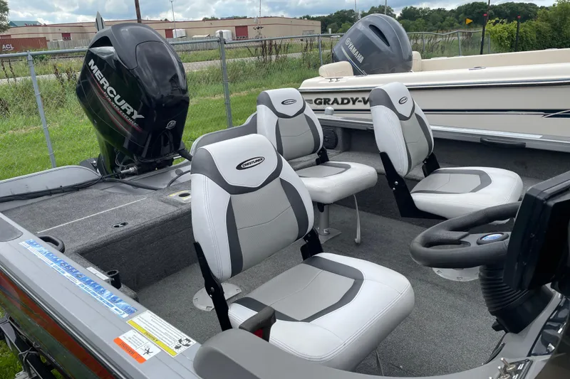 Slide: The Image of 2014 Crestliner 1750 Fish Hawk boat interior with Mercury outboard motor and seating. - 28