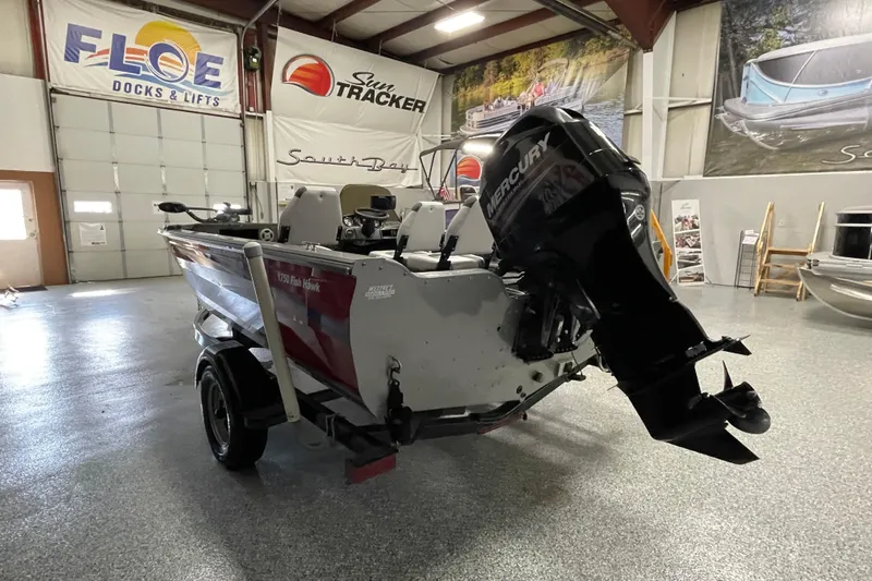 Slide: The Image of 2014 Crestliner 1750 Fish Hawk boat with Mercury engine in showroom. - 3