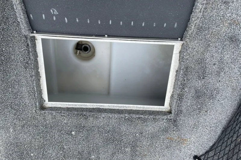 Slide: The Image of Open compartment on 2014 Crestliner 1750 Fish Hawk boat deck. - 34