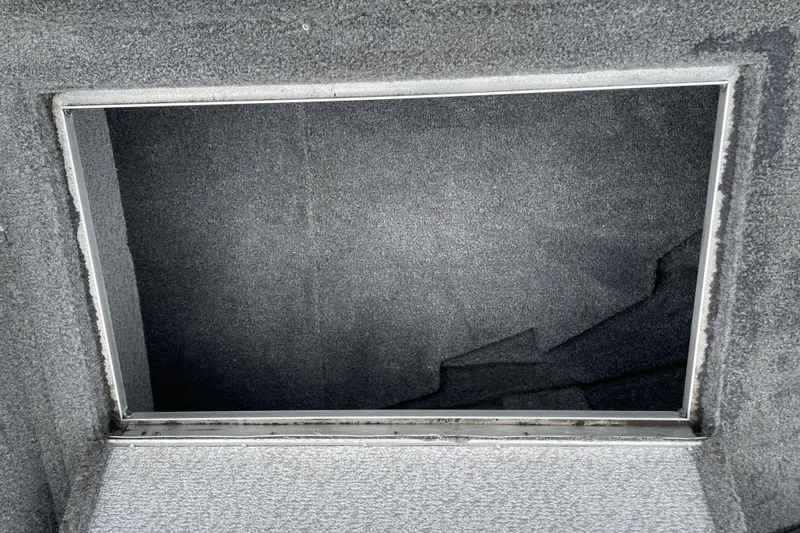 Slide: The Image of Open storage compartment in 2014 Crestliner 1750 Fish Hawk boat. - 36