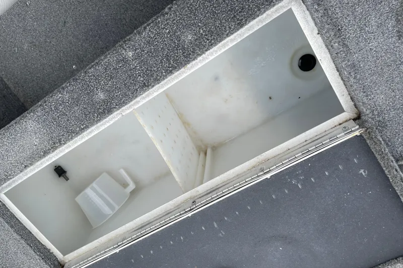 Slide: The Image of Open storage compartment in 2014 Crestliner 1750 Fish Hawk boat. - 37