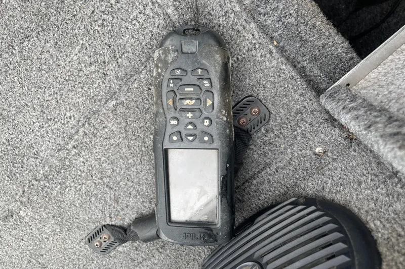 Slide: The Image of Weathered boat control panel on 2014 Crestliner 1750 Fish Hawk's carpeted floor. - 39