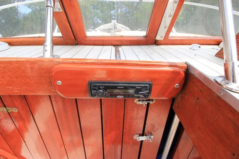 Slide: The Image of 1963 Thompson Skiff Craft 21 interior with wood paneling and Sony stereo system. - 15