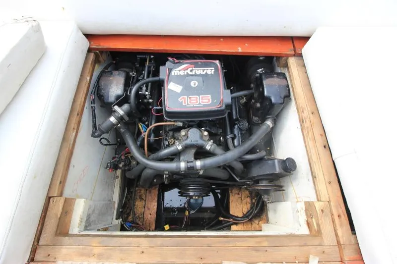 Slide: The Image of 1963 Thompson Skiff Craft 21 engine compartment with MerCruiser 185 engine. - 18