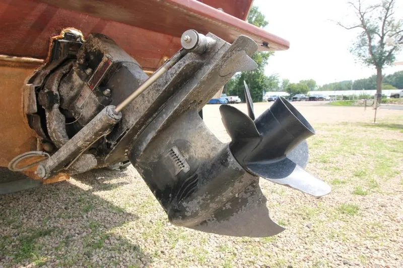 Slide: The Image of 1963 Thompson Skiff Craft 21 boat propeller and drive system, displayed outdoors. - 3