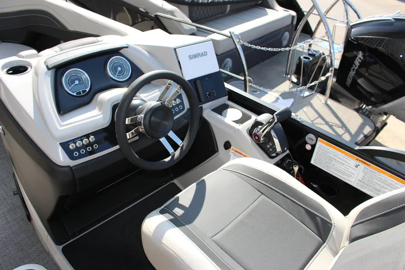 Slide: The Image of 2026 Barletta Cabrio 22QC boat dashboard with steering wheel and control panel. - 11