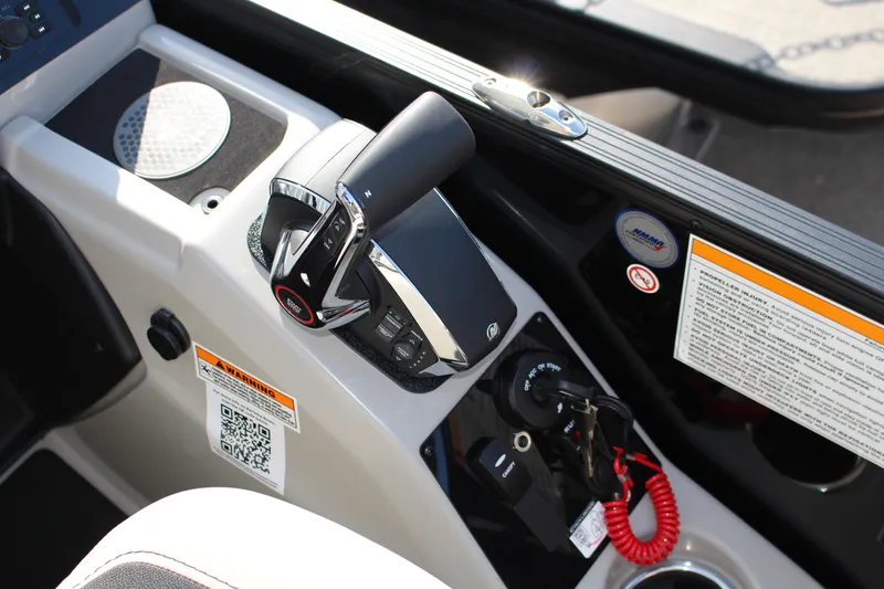 Slide: The Image of Control panel of 2026 Barletta Cabrio 22QC boat with throttle and safety features. - 13
