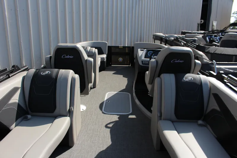 Slide: The Image of 2026 Barletta Cabrio 22QC pontoon boat interior with luxurious seating and modern design. - 18