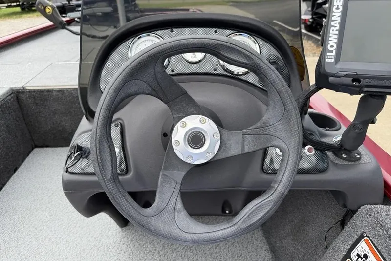 Slide: The Image of Steering wheel and dashboard of 2019 Tracker Pro 170 boat with Lowrance fish finder. - 16