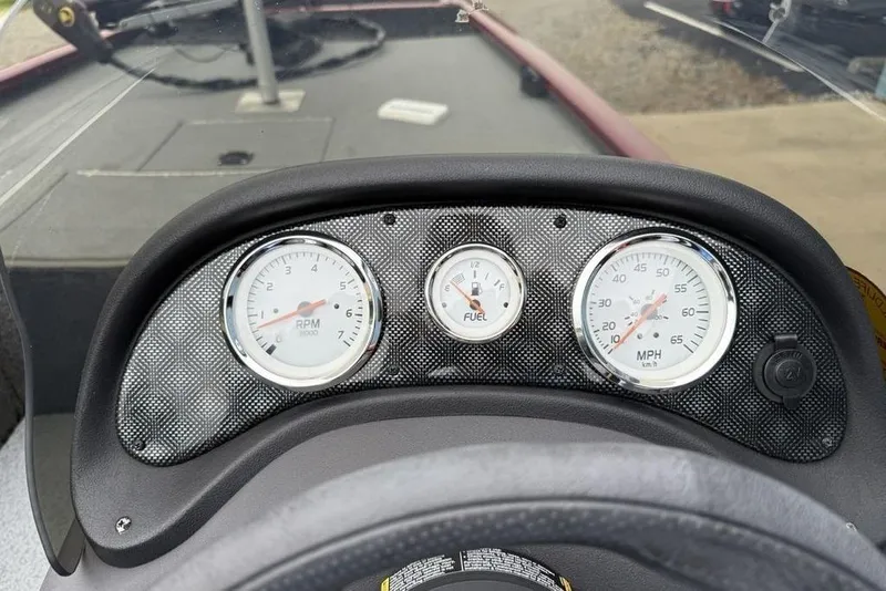 Slide: The Image of Dashboard of a 2019 Tracker Pro 170 boat with RPM, fuel, and speed gauges. - 17