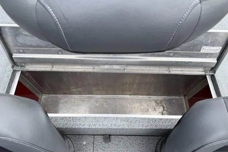 Slide: The Image of 2019 Tracker Pro 170 boat storage compartment with gray seating. - 21