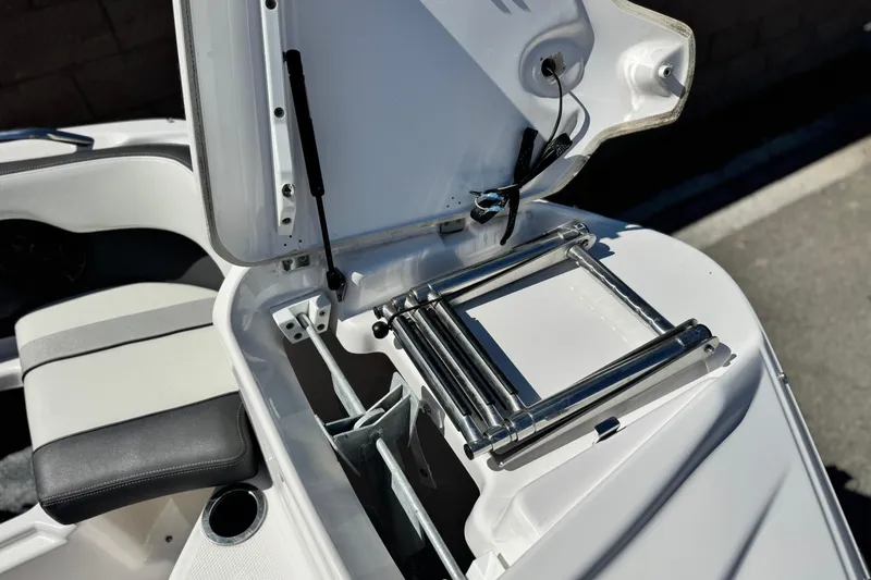 Slide: The Image of 2022 Yamaha Boats 212 with open storage compartment and stainless steel ladder. - 14