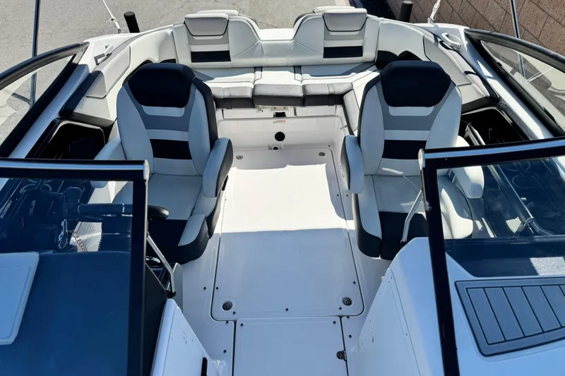 Slide: The Image of 2022 Yamaha Boats 212 interior with sleek seating and modern design. - 15