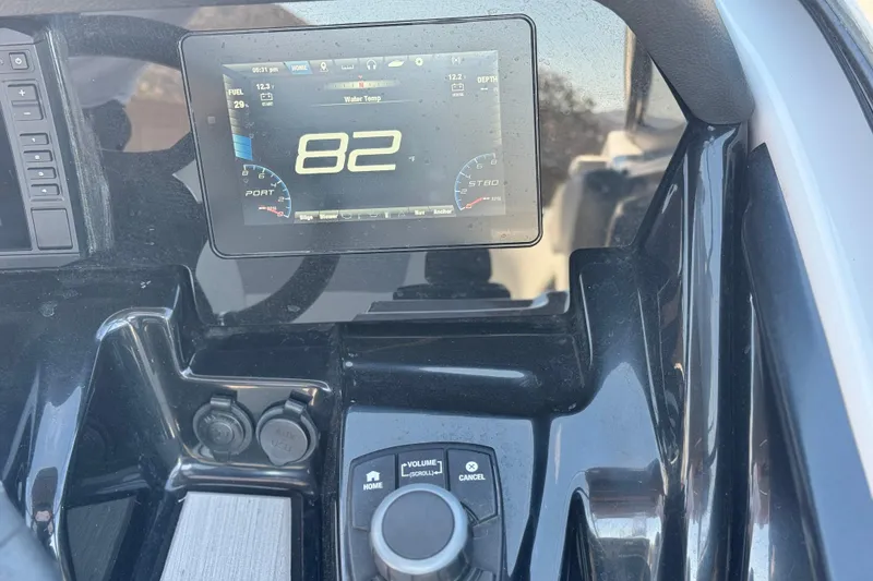 Slide: The Image of Dashboard of 2022 Yamaha Boats 212 showing digital display and controls. - 27