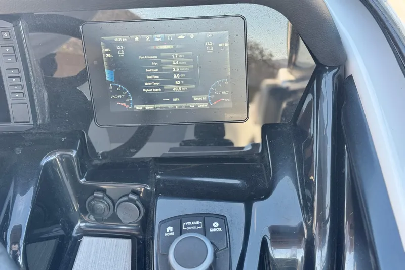Slide: The Image of Dashboard of a 2022 Yamaha Boats 212, featuring digital display and controls. - 28