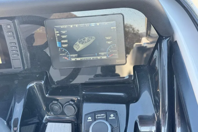 Slide: The Image of Dashboard of a 2022 Yamaha Boats 212, featuring a digital display and controls. - 29