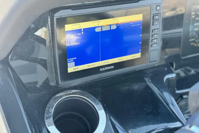 Slide: The Image of Garmin GPS display on 2022 Yamaha Boats 212 dashboard, showing navigation data. - 30